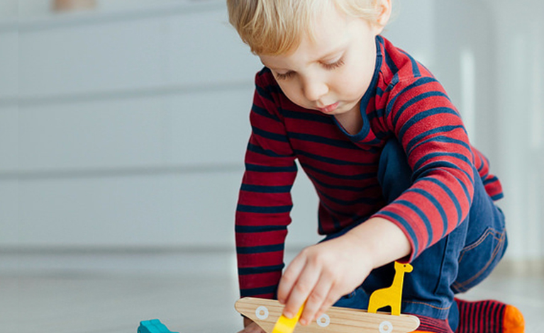 Toddler playing in his bedroom